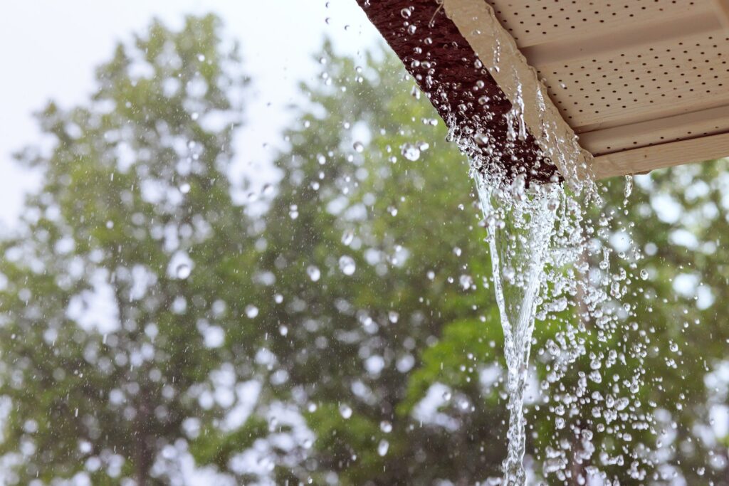 Gutters Overflowing During Heavy Rainfall And Dripping Water